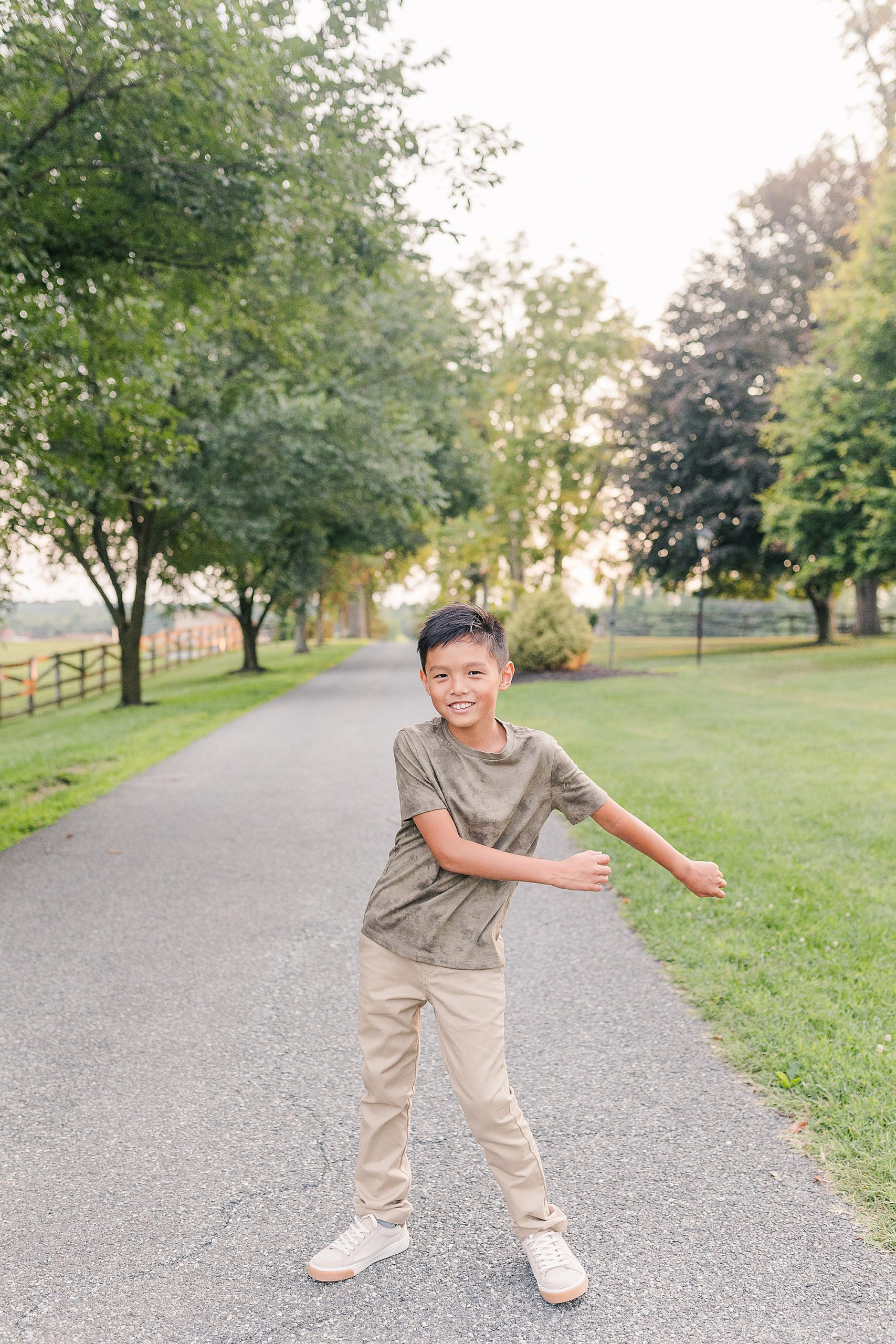 kid dances during family photos in Maryland