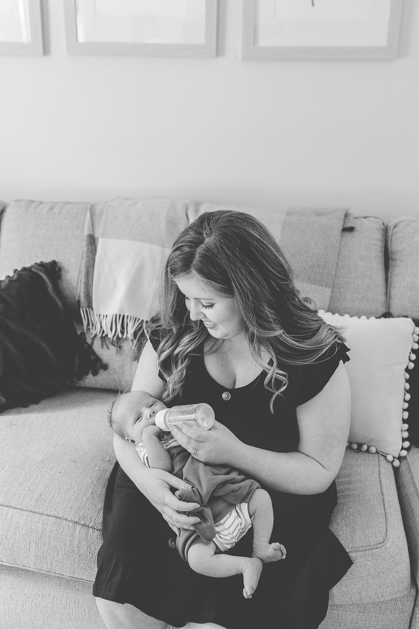 mom looks at baby boy during lifestyle family photos 