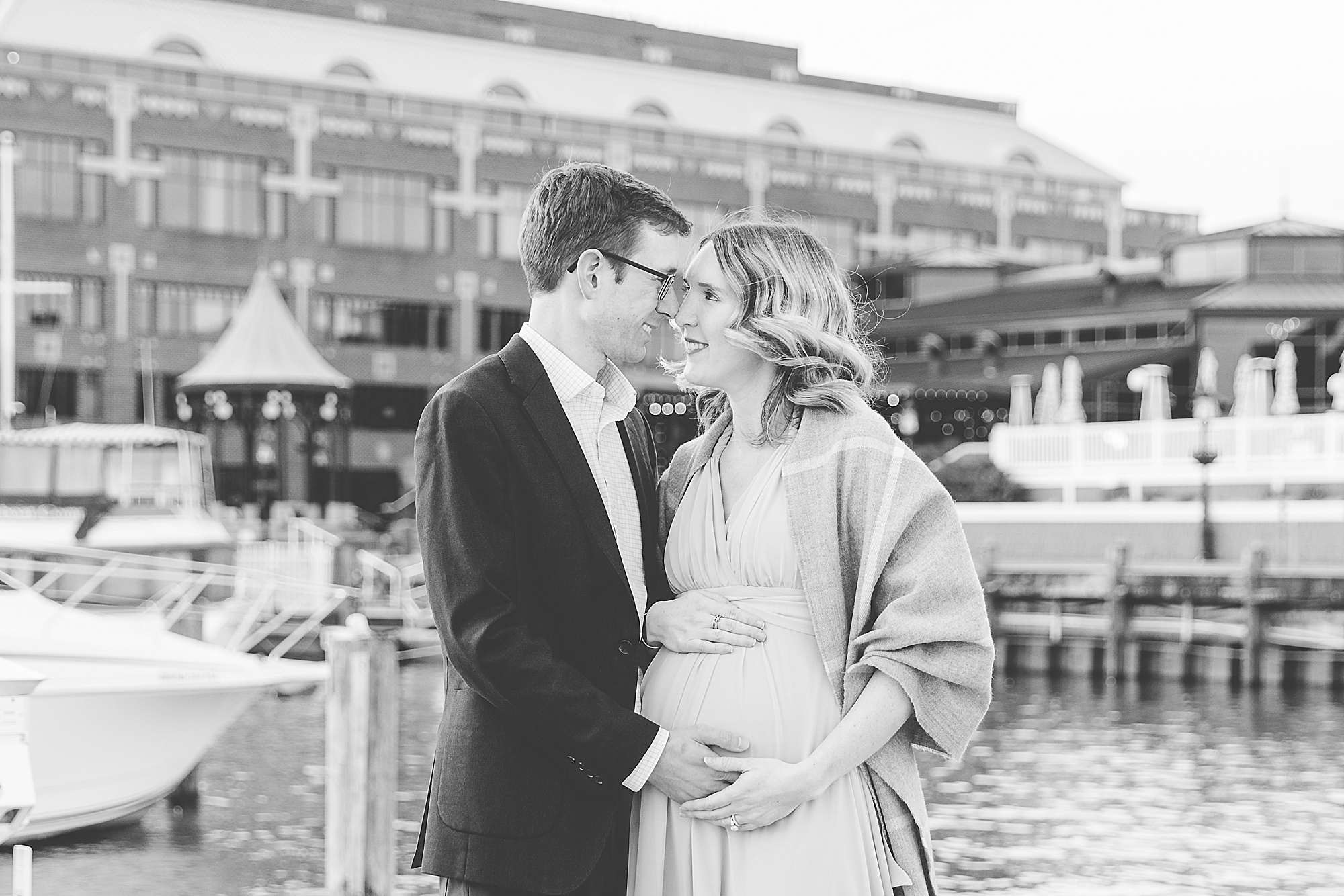 expecting parents look at each other during Historic Alexandria VA maternity photos 