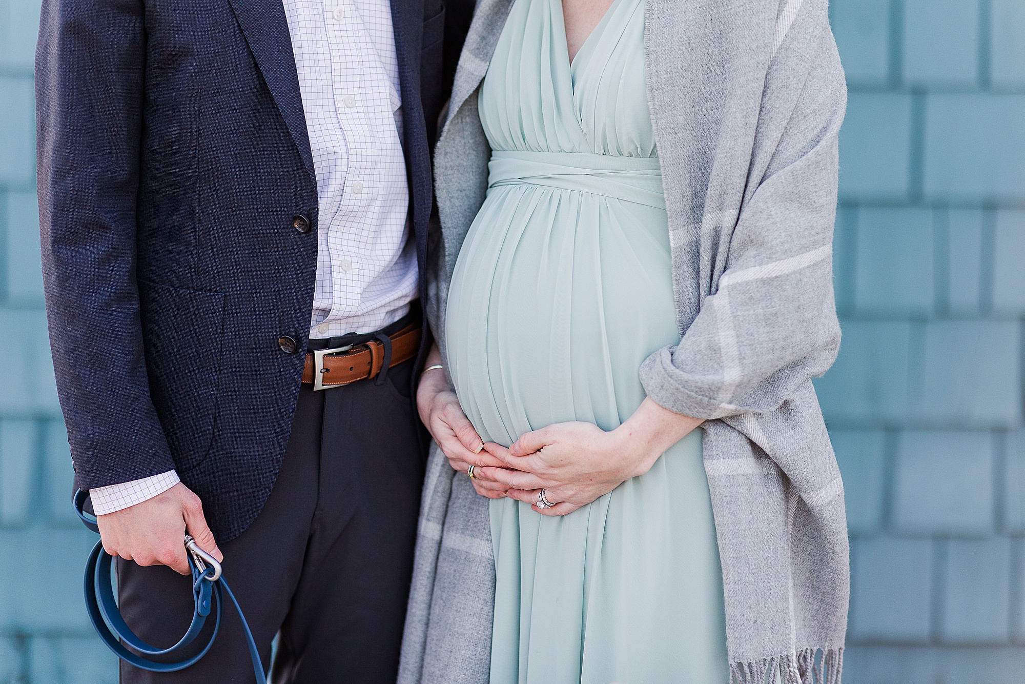 mom holds belly in light green gown during gHistoric Alexandria VA Maternity Session