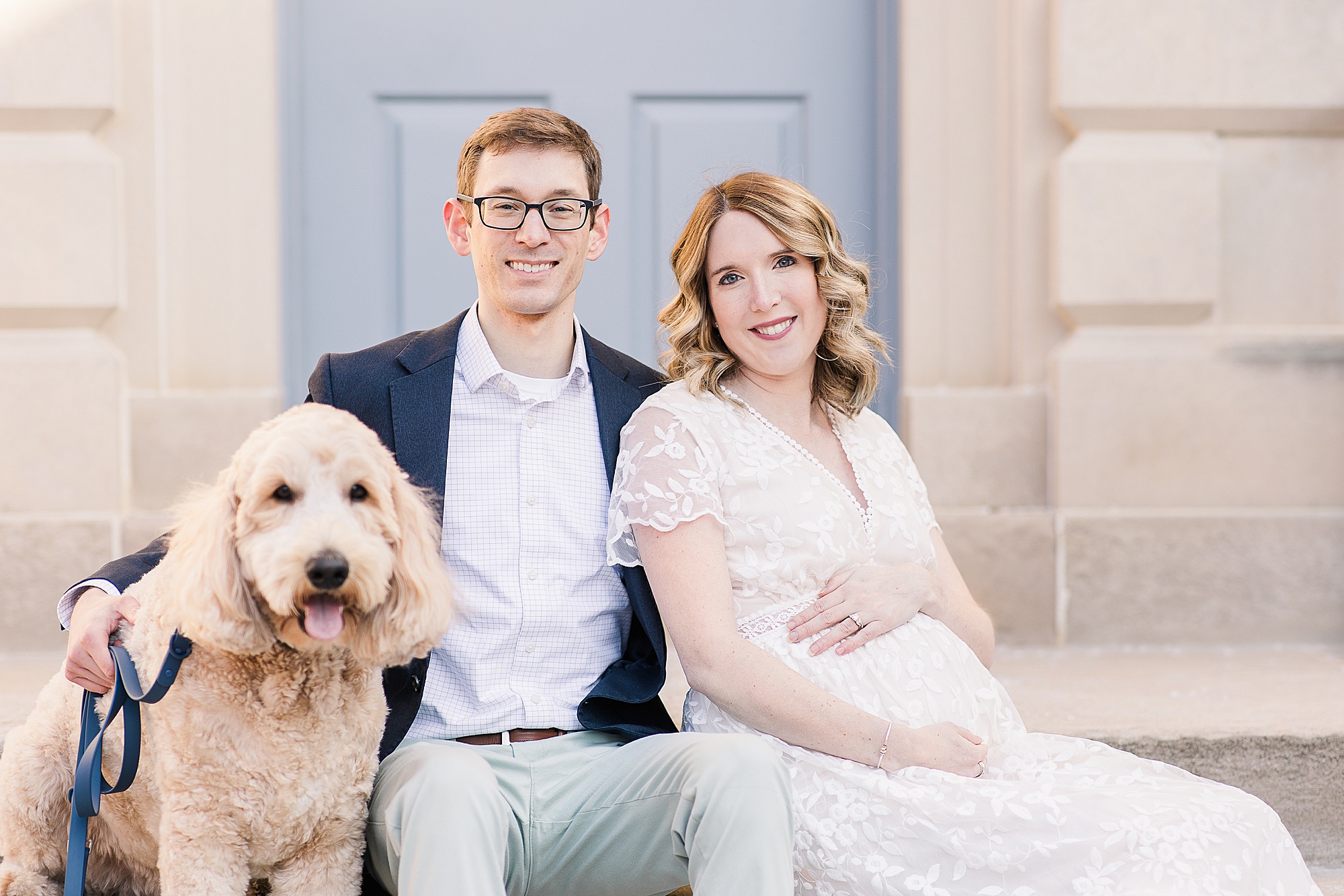 parents pose on steps of historic home in Alexandria VA with dog