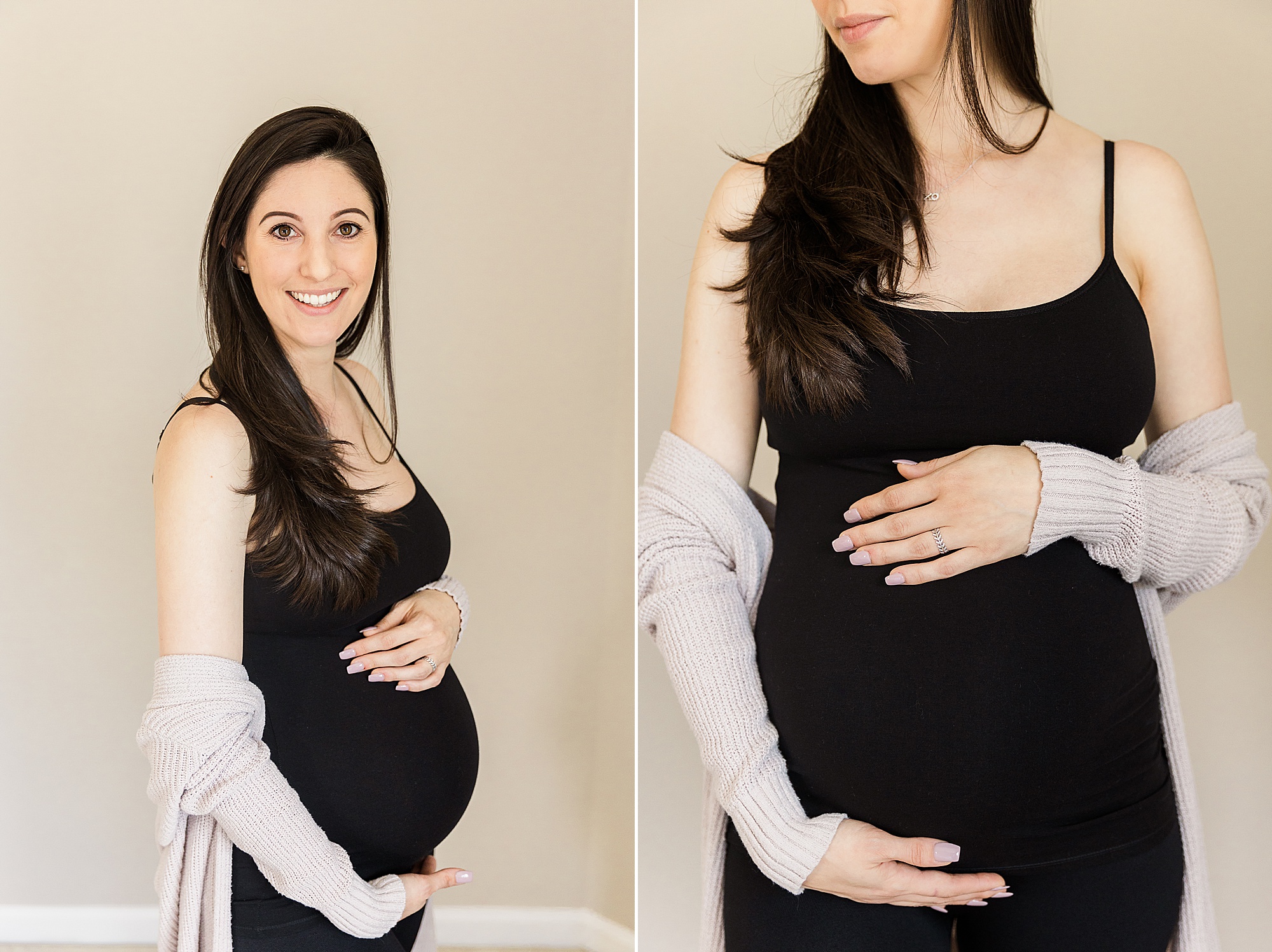 mom poses in black tank top holding belly during maternity photos