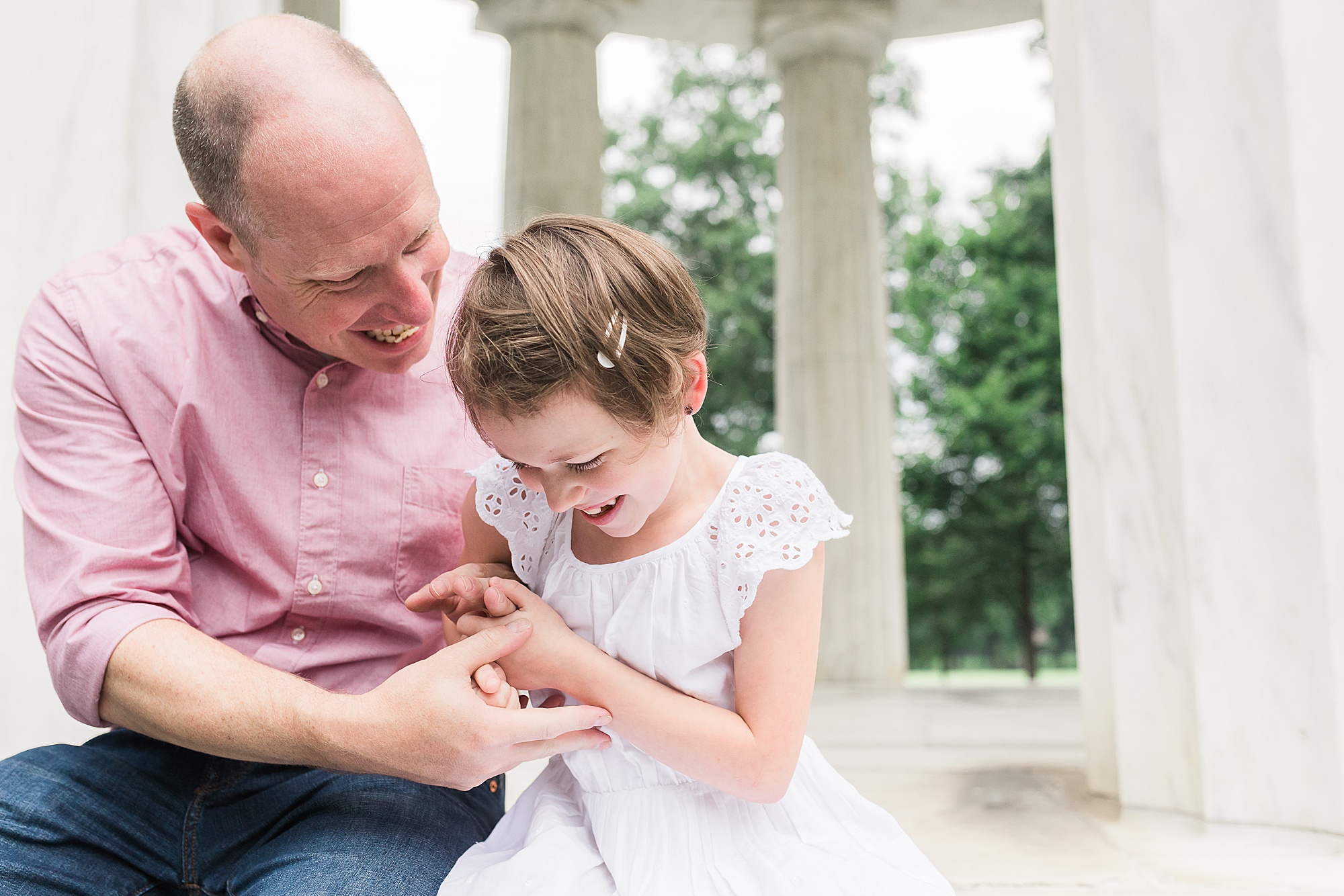 dad sits with daughter during Washington DC Family Portraits
