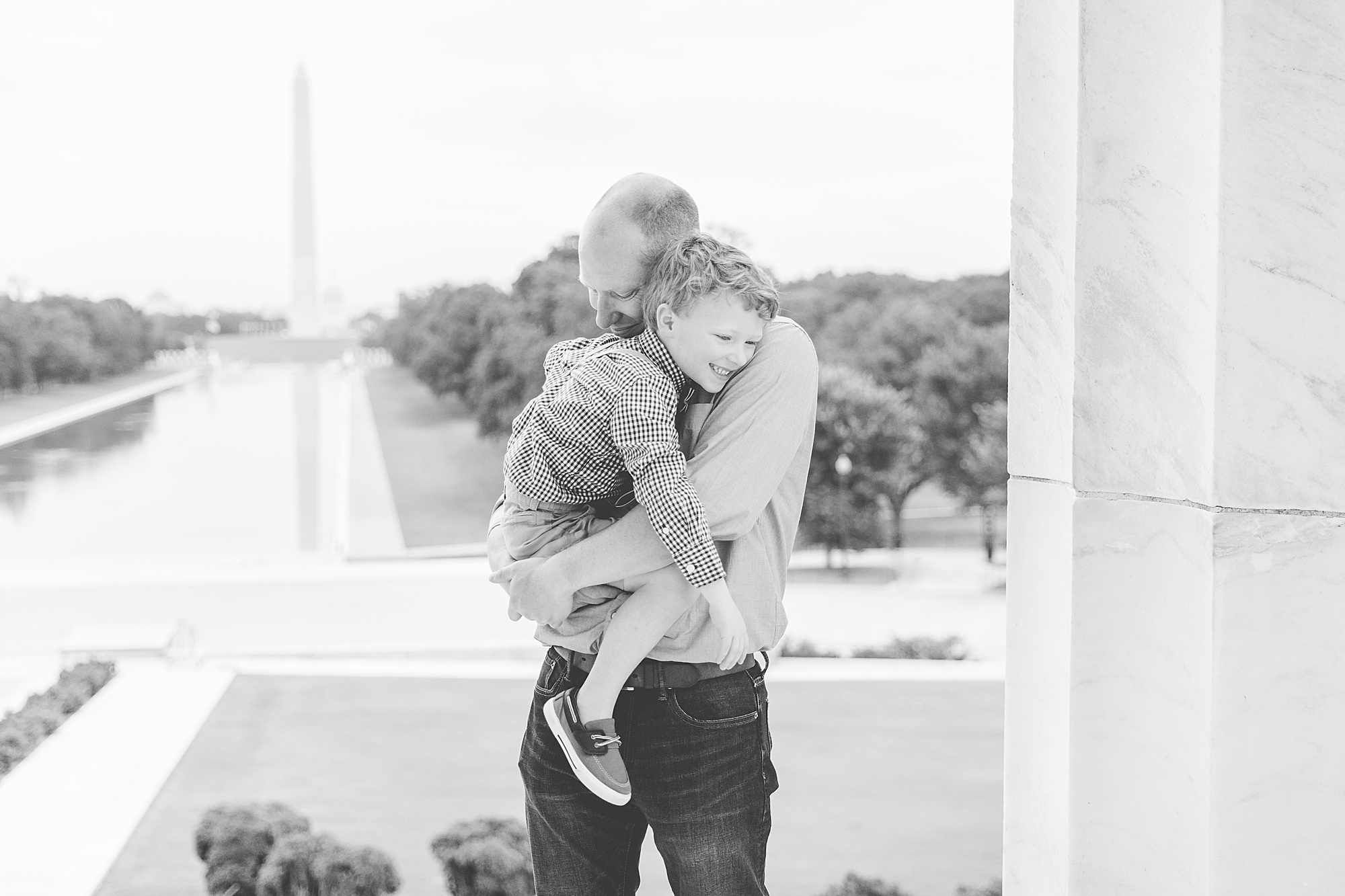 dad hugs son during Washington DC Family Portraits