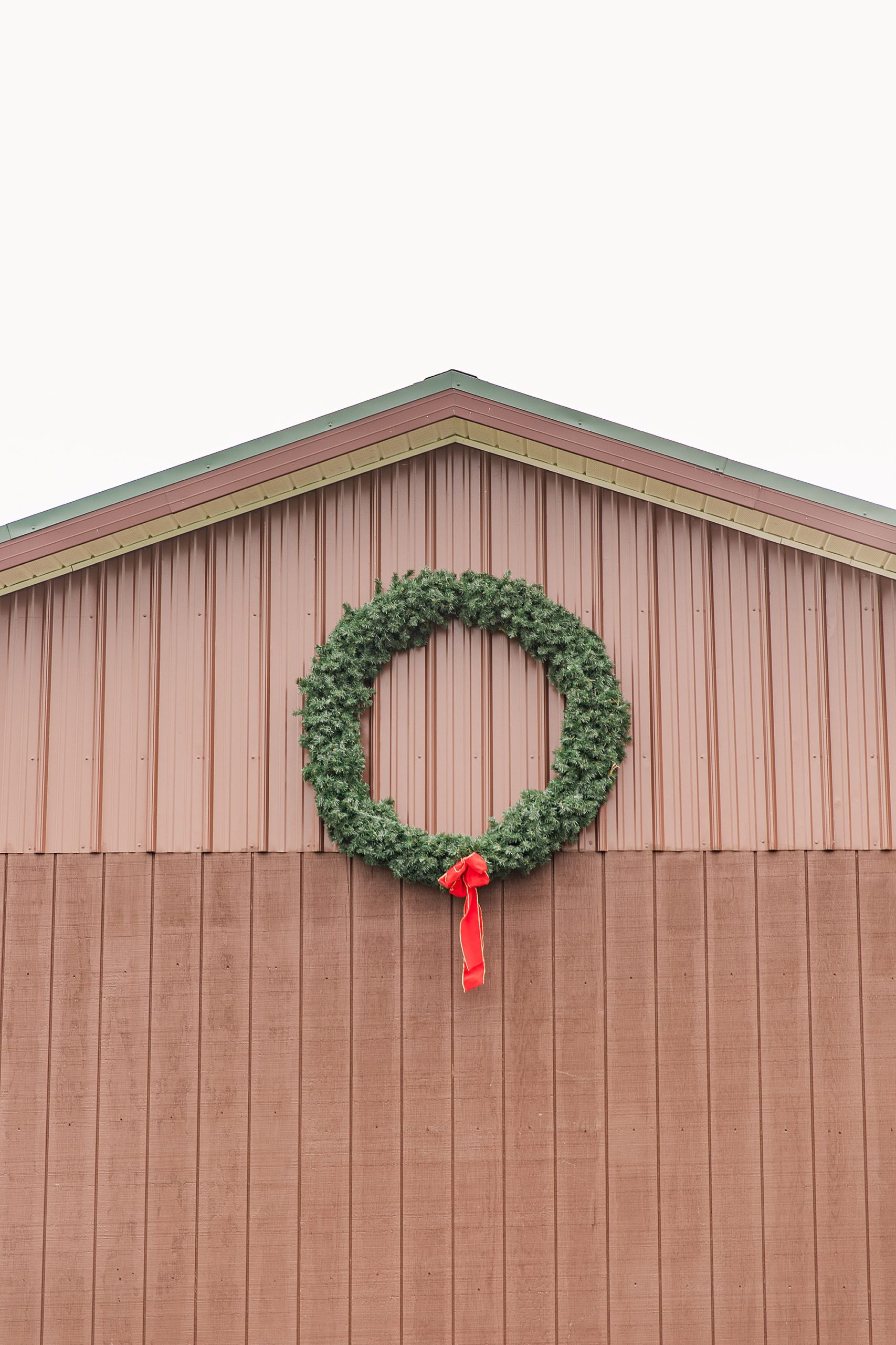 Christmas wreath hangs outside Greenway Tree Farm