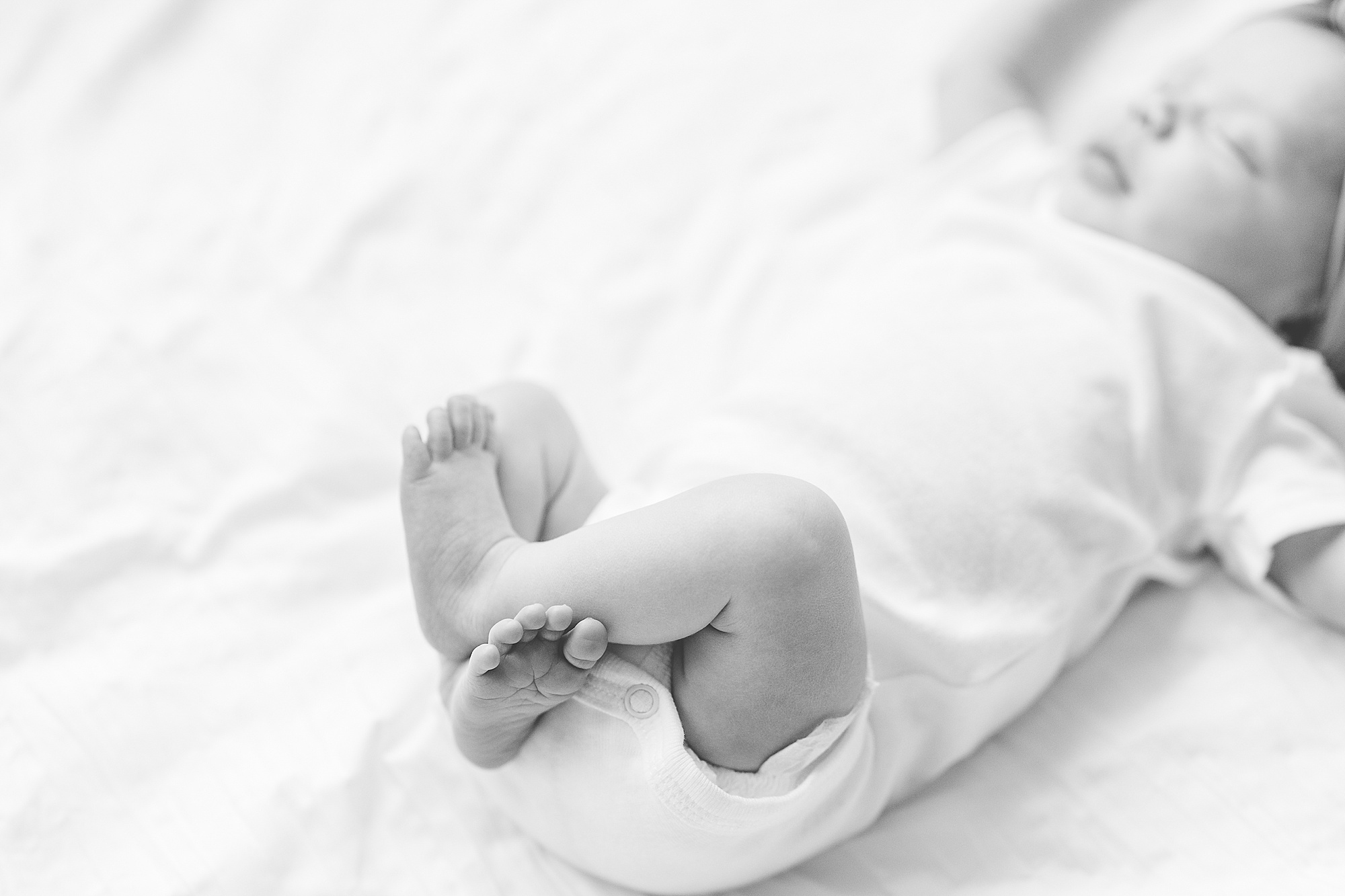 baby's toes crossed during Lifestyle Newborn Session in Annapolis