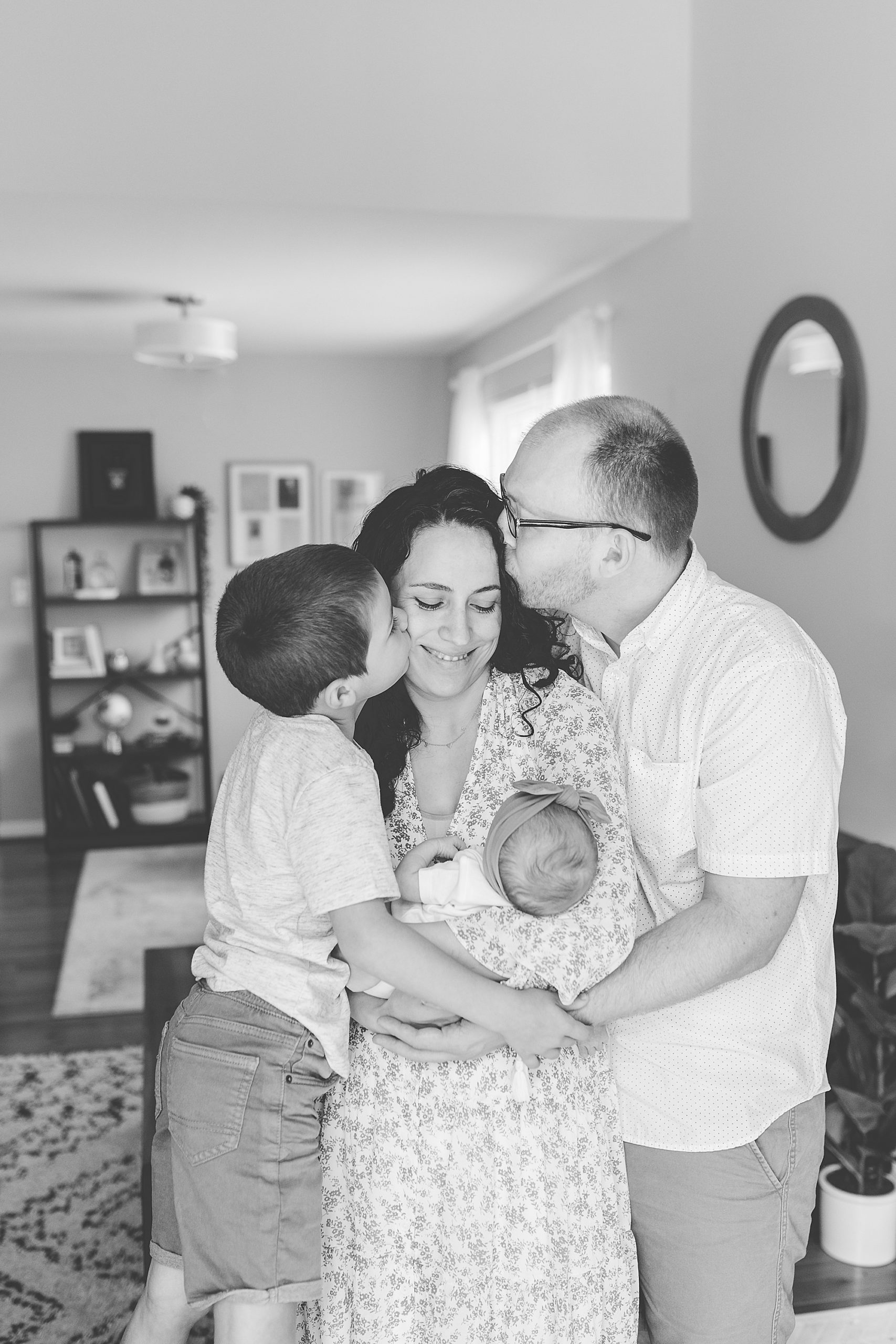 family hugs during Lifestyle Newborn Session in Annapolis
