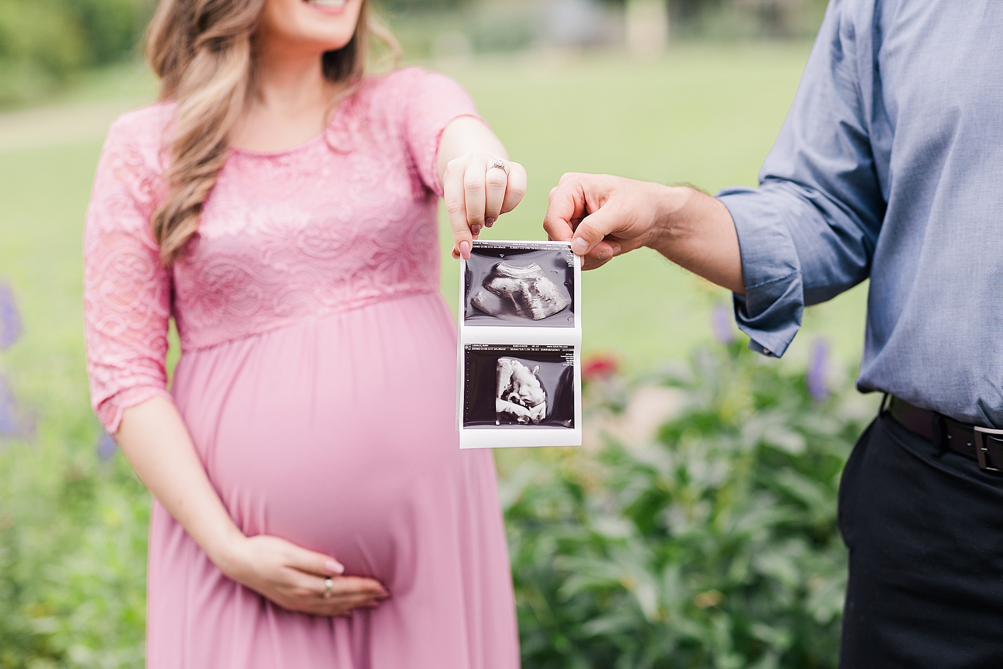 couple holds sonogram picture during Alexandria VA maternity session 