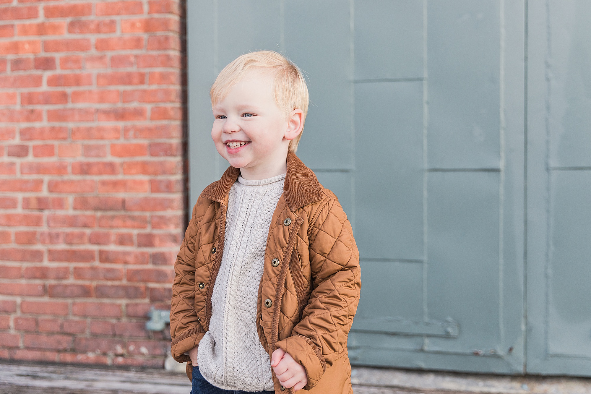 toddler plays during Fells Point MD family photos