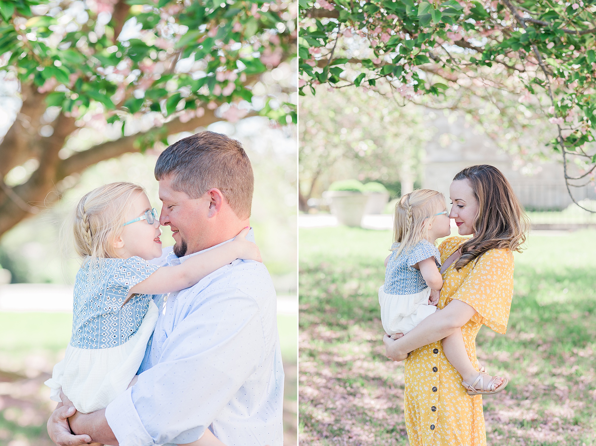 parents hold daughter during family photos 