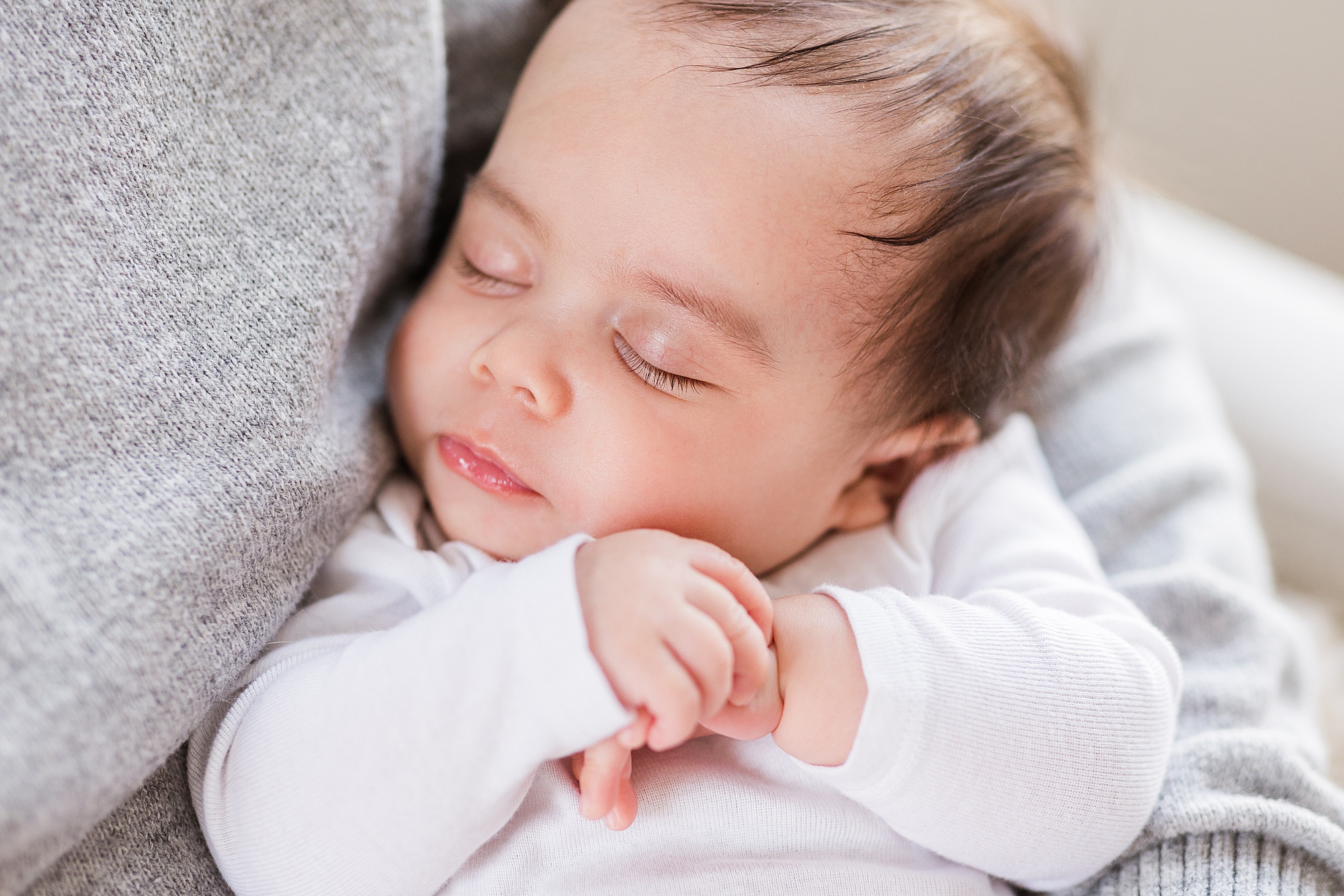 baby sleeps on dad's chest during MD newborn photos 