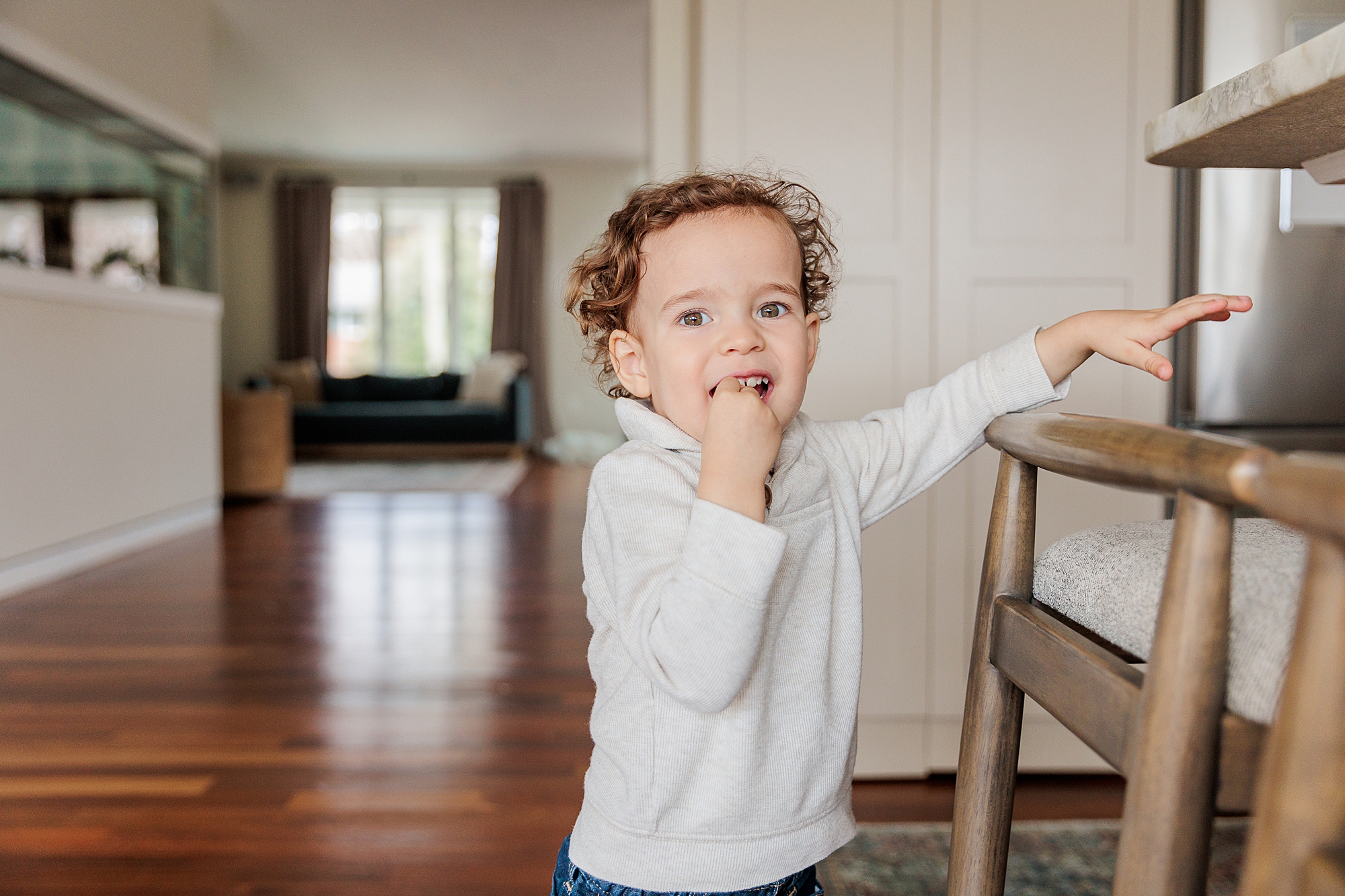 toddler plays in kitchen during MD family photos