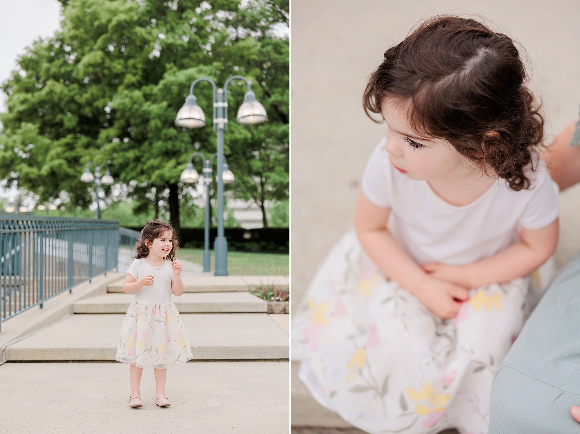 toddler sits in white floral dress for family photos 