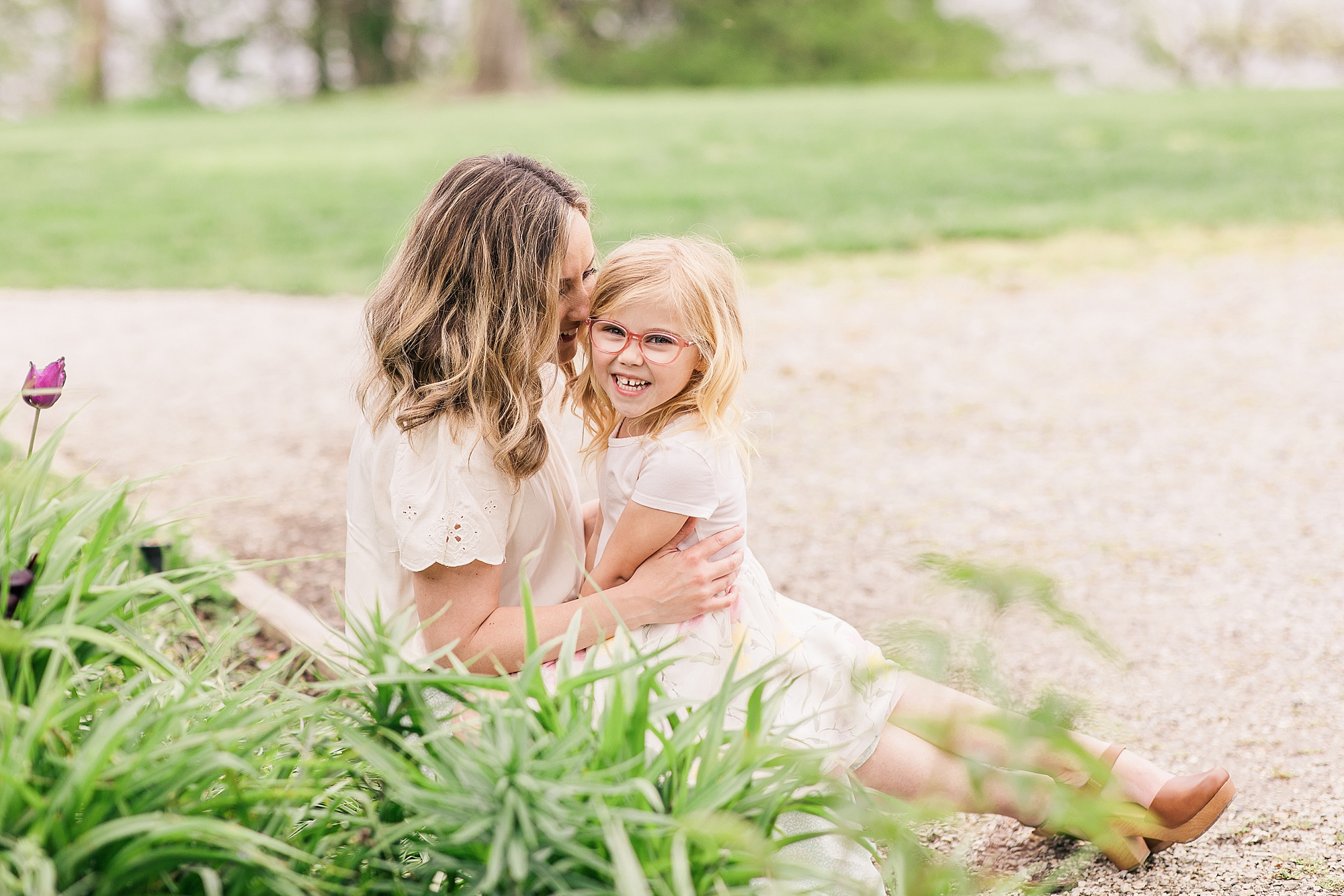 mom holds daughter in lap during Annapolis MD family photos