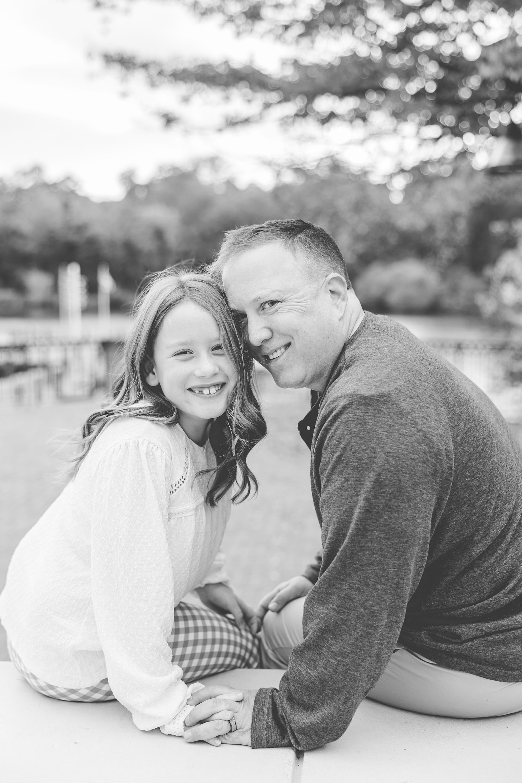dad and daughter hug during family photos in Maryland 