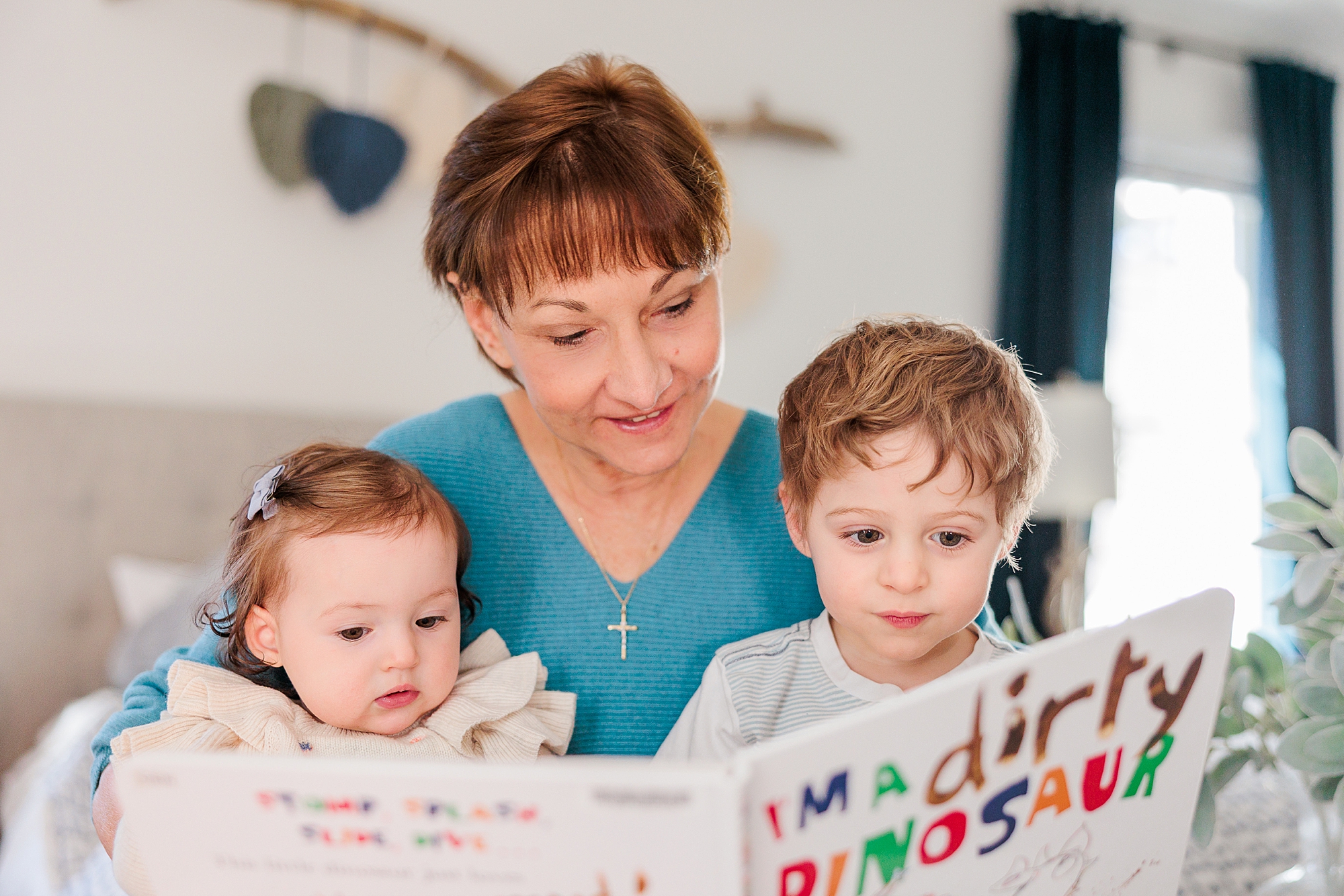 grandmother reads book to grandchildren during extended family session in Bethesda, Maryland 