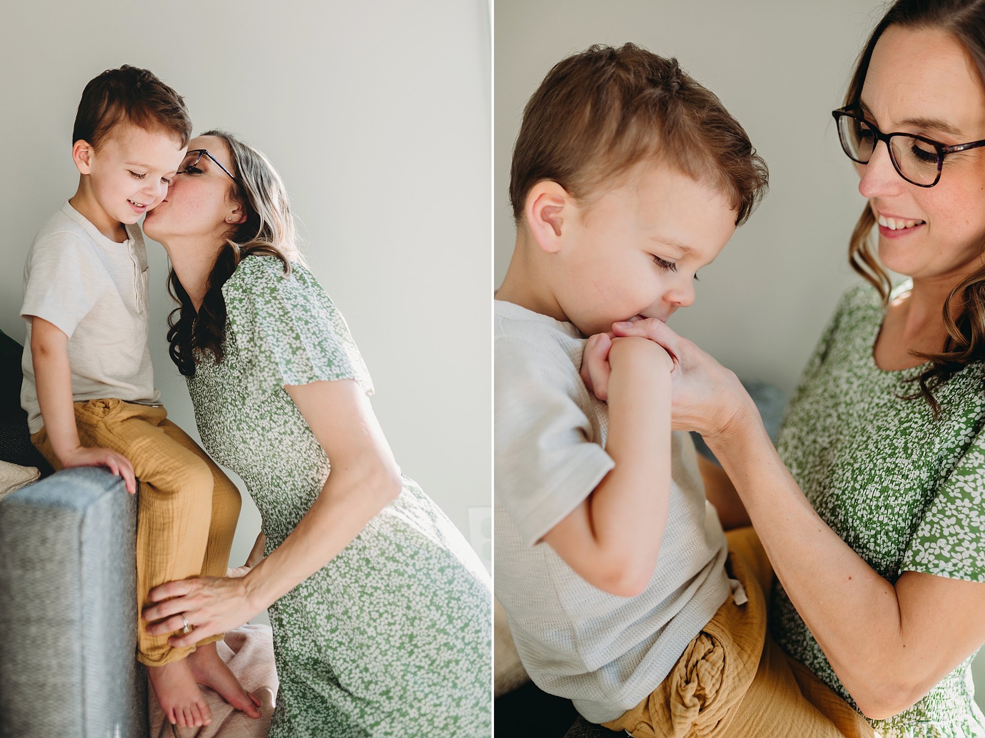 mom leans to kiss son's cheek during family photos at home 