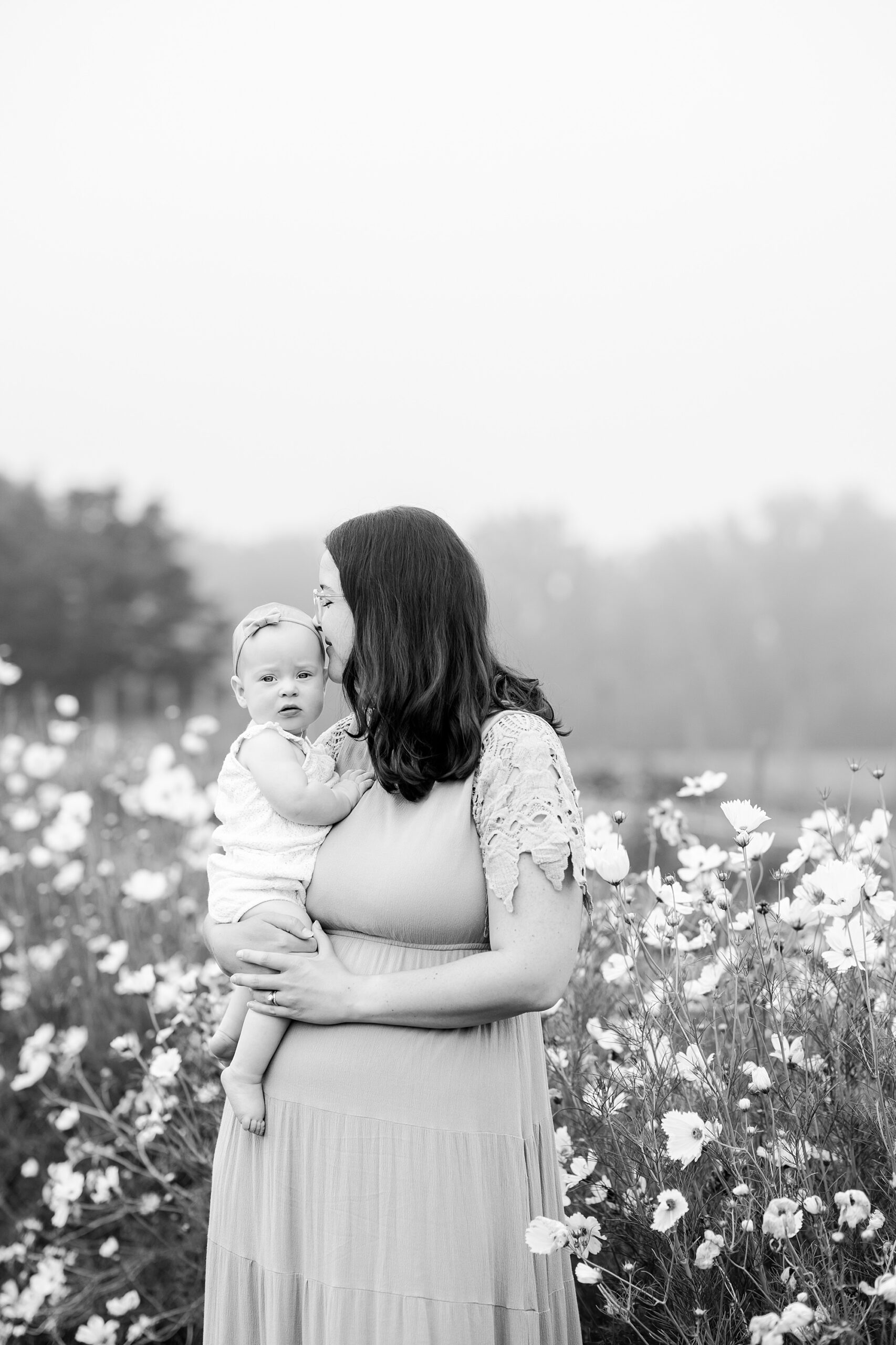 mom kisses daughter's forehead during mom and me photos at Castlebridge Farm
