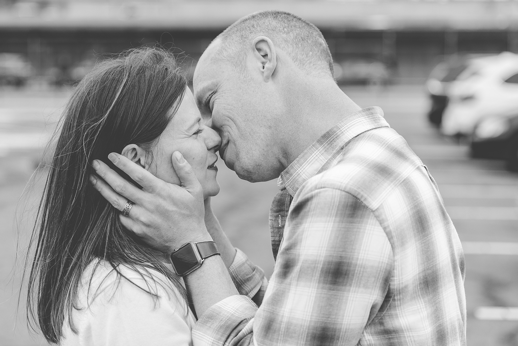 couple kisses after being reunited post military deployment 