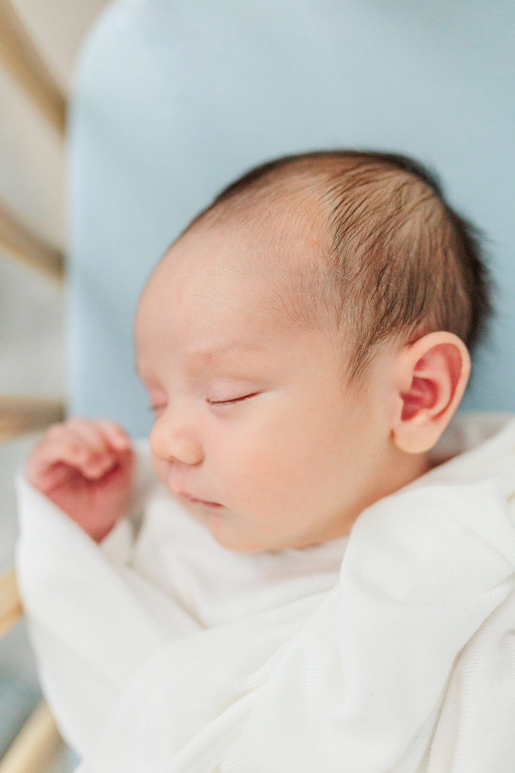 baby sleeps on blue crib sheet during Northern Virginia newborn session