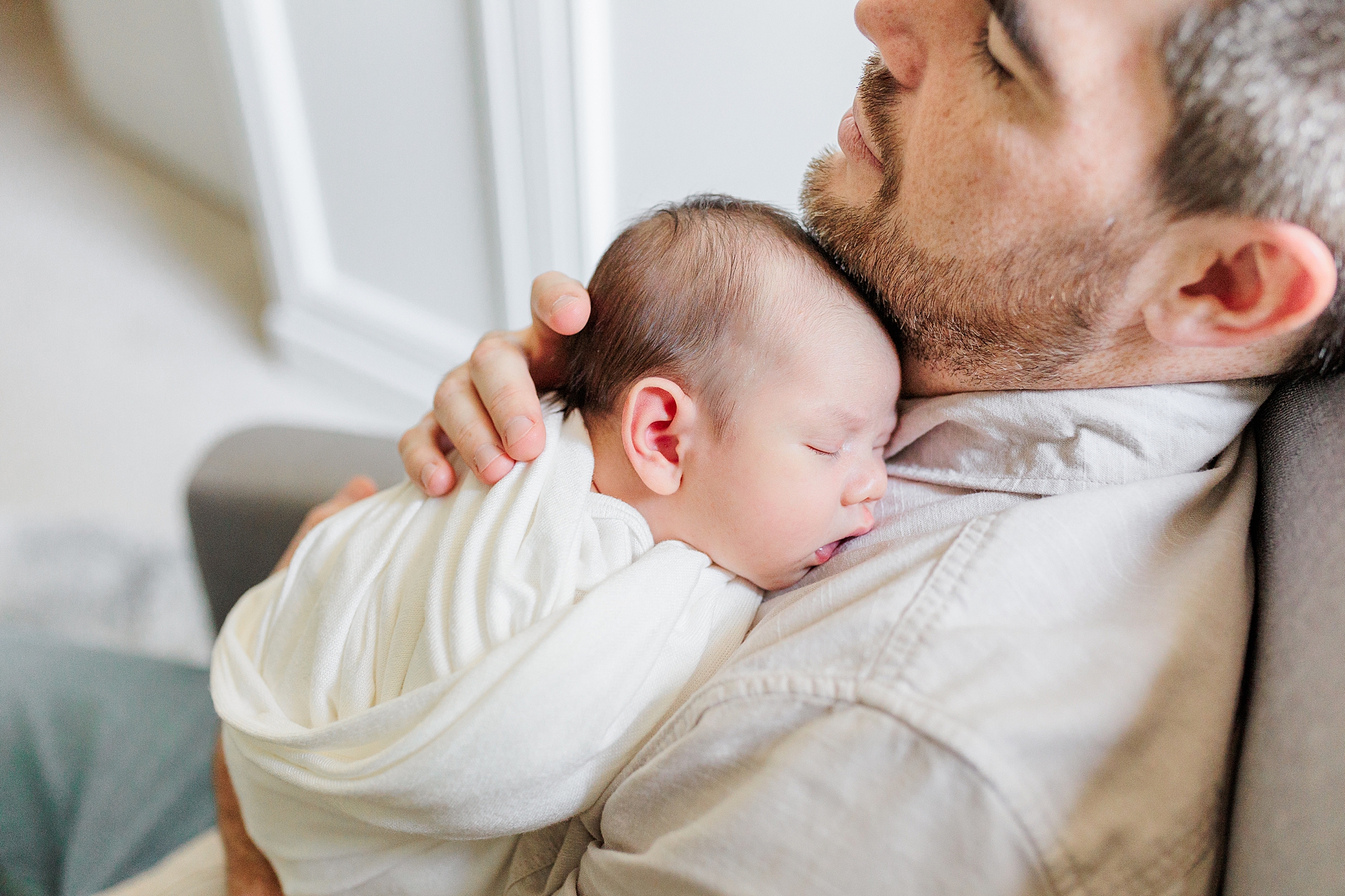dad rocks son in nursery during Northern Virginia newborn session