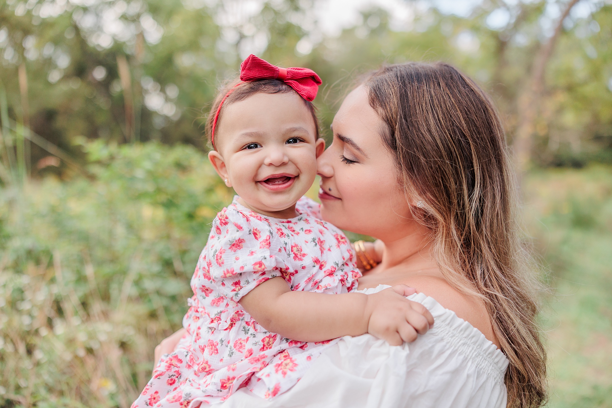 mom nuzzles daughter's cheek during family photos with Northern Virginia family photographer Christina tundo Photography