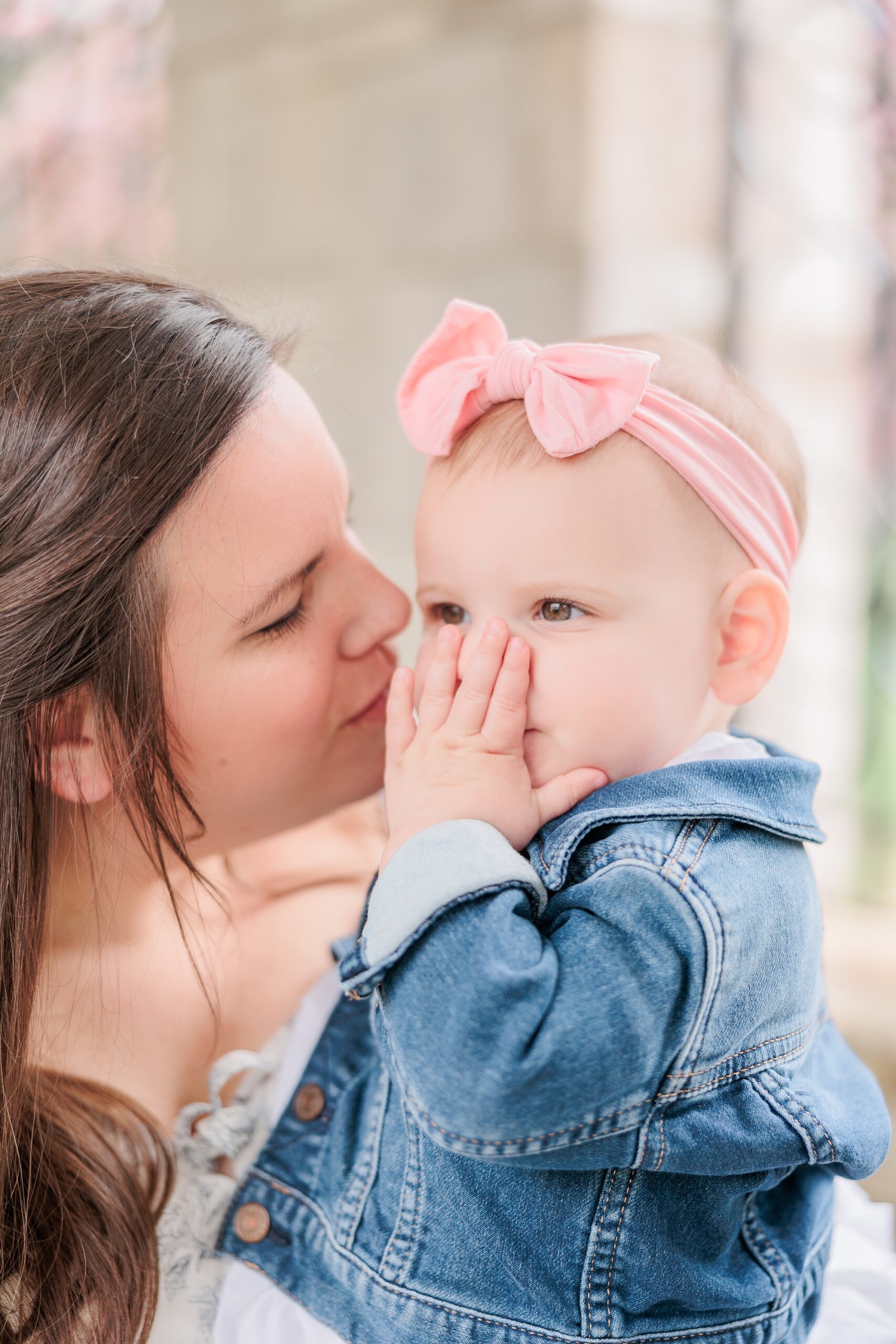 mom kisses baby's cheek during Maryland family photos