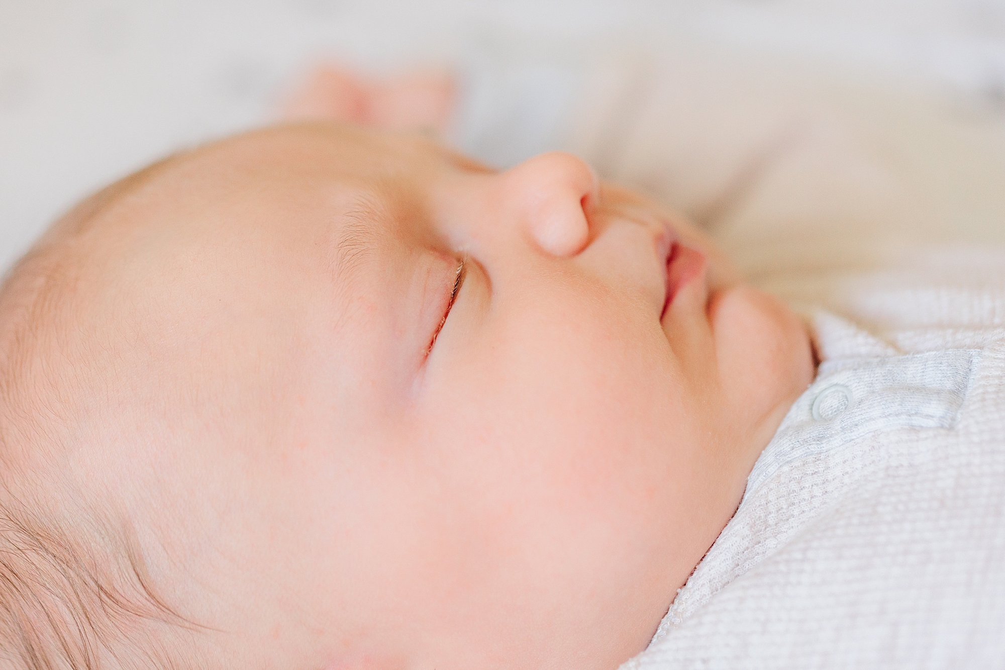 baby sleeps during newborn photos at home 