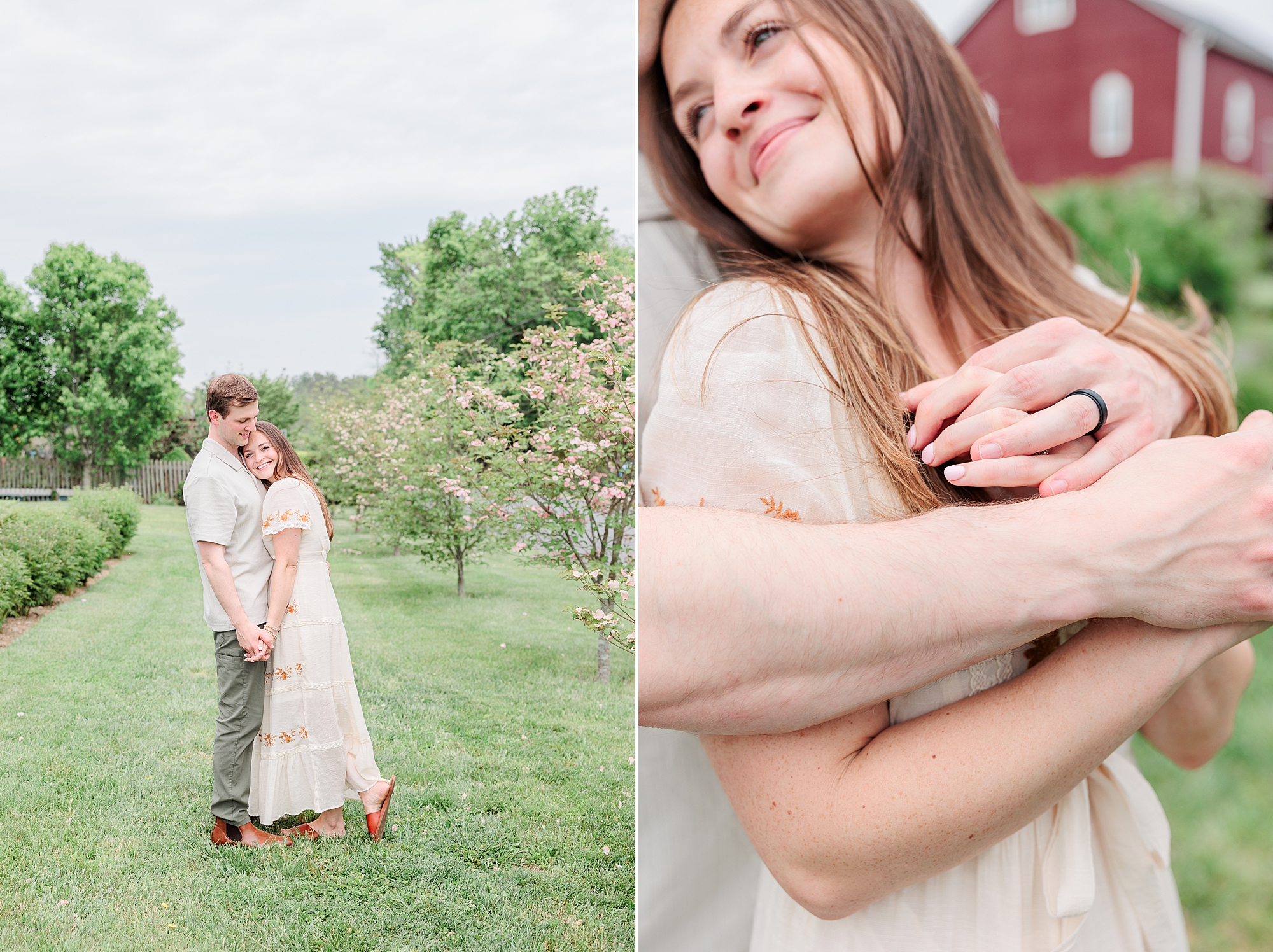 man hugs wife in front of red farm house
