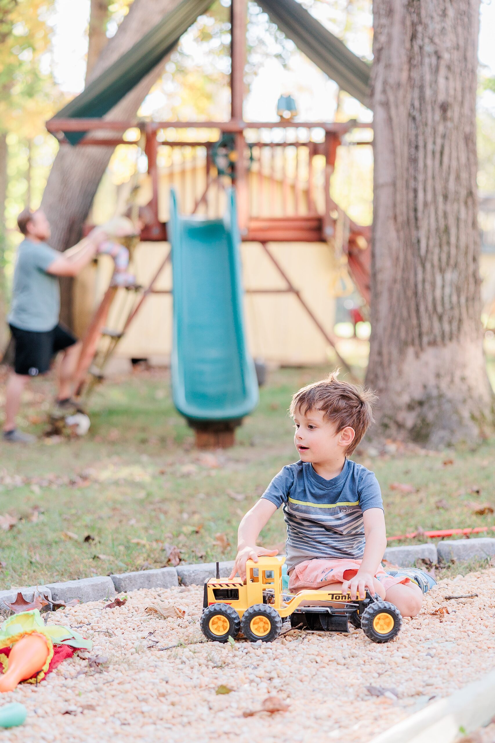 boy plays with truck in sandbox during Maryland documentary family photos